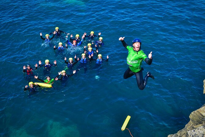 Coasteering Experience in Newquay - Swimming through the sea cave