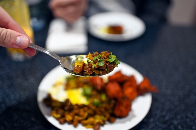 East London Indian Food Tour with 8+ Authentic Food Tastings - The first bites: pakoras, chickpeas, and lassi