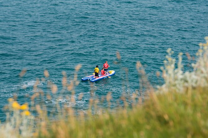 Giant Stand Up Paddle Boarding Experience in Newquay - Coves, caverns, and pirate stories