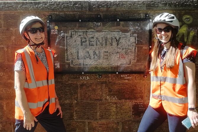 Half-Day Liverpool Electric Beatles Bike Tour - Penny Lane and the details beyond the sign