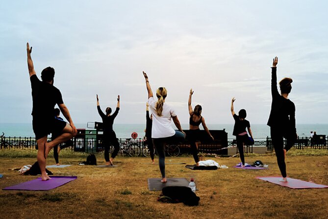 Outdoor Yoga Class at Brighton's Sea front - Brighton beach on Monday morning