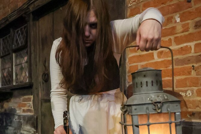 Tudor World Ghost Tour by Lantern light inside the building - Entering Tudor World after closing